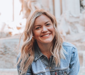woman smiling wearing denim jacket