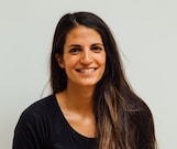 woman wearing black scoop-neck long-sleeved shirt